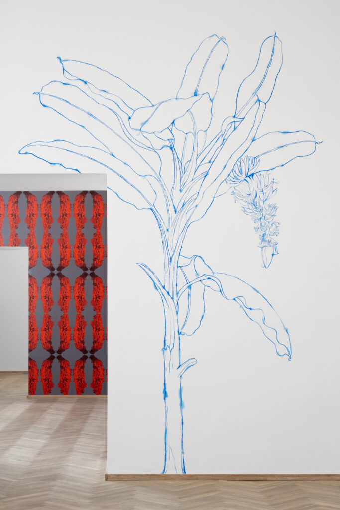 An exhibition space with artworks on the walls.