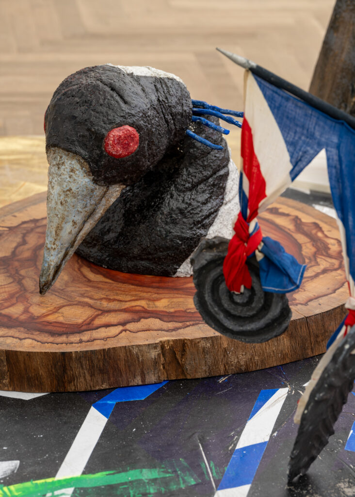 Detail view of an artwork depicting a bird.