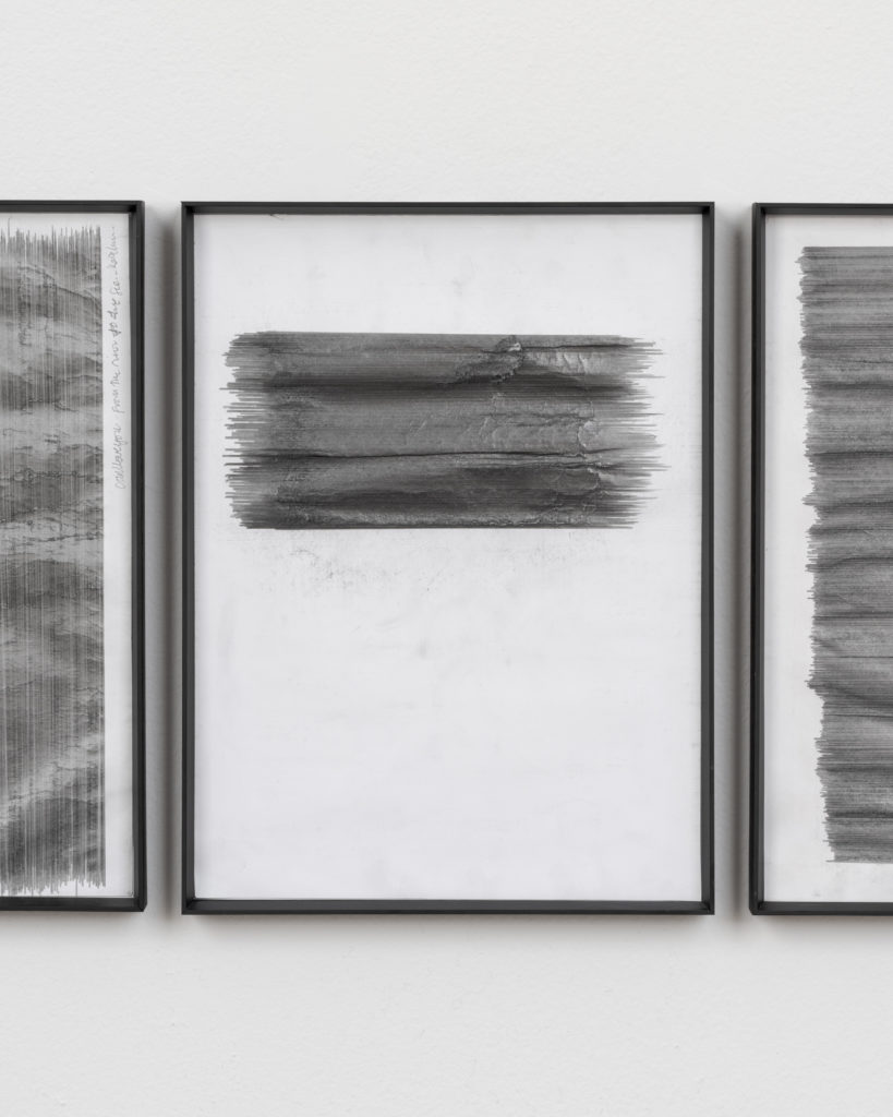 Three framed paintings.