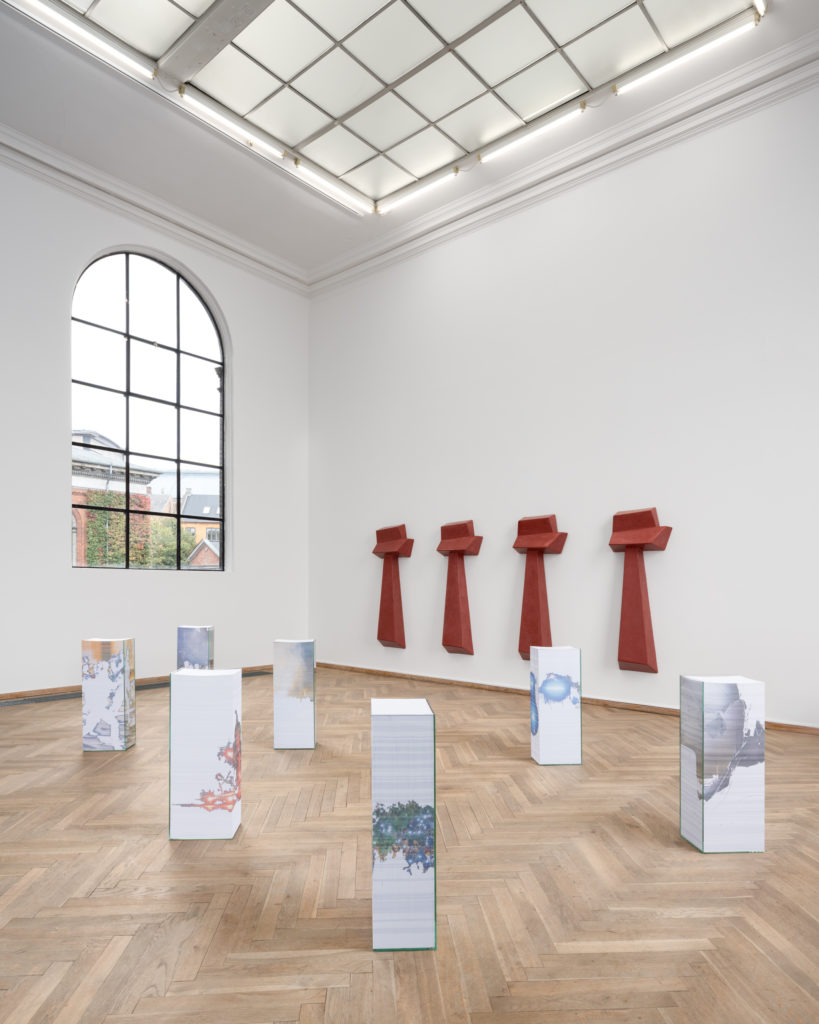 An exhibition space with various sculptures.