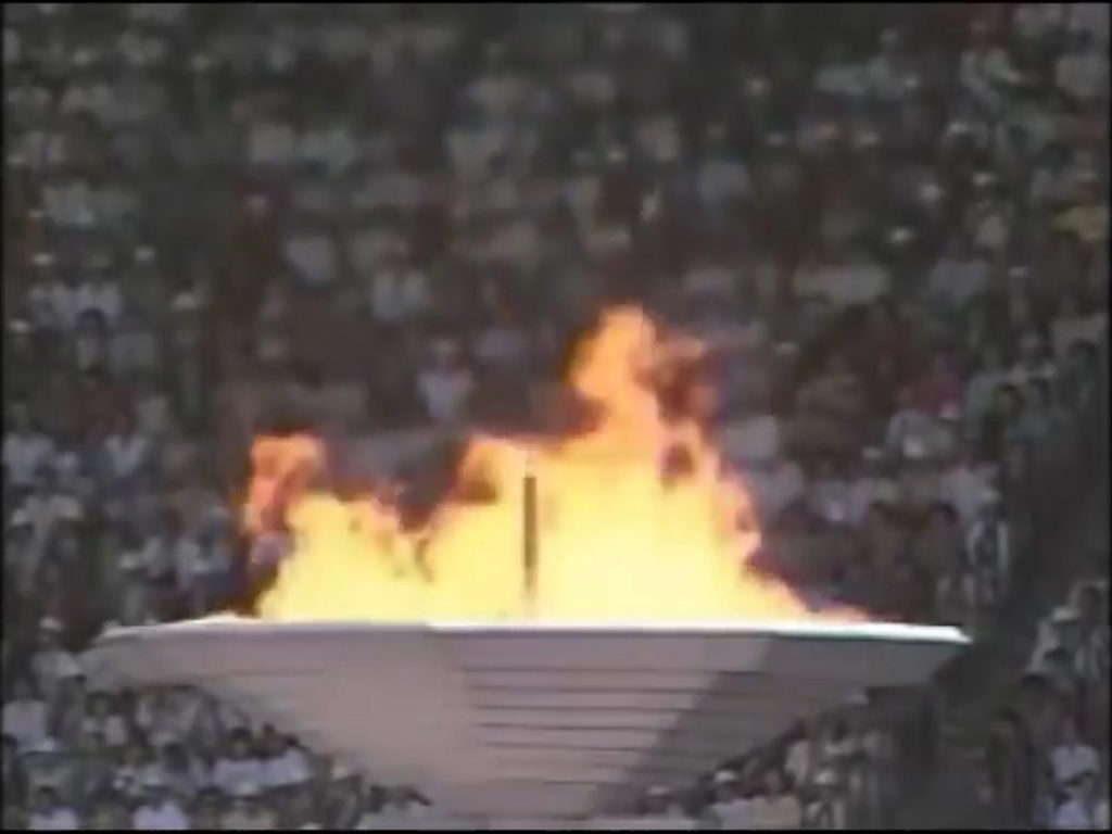 Olympic flame in front of audience
